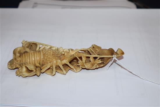 A Japanese ivory okimono of rats crawling over a lobster, early 20th century, unsigned 14.5cm